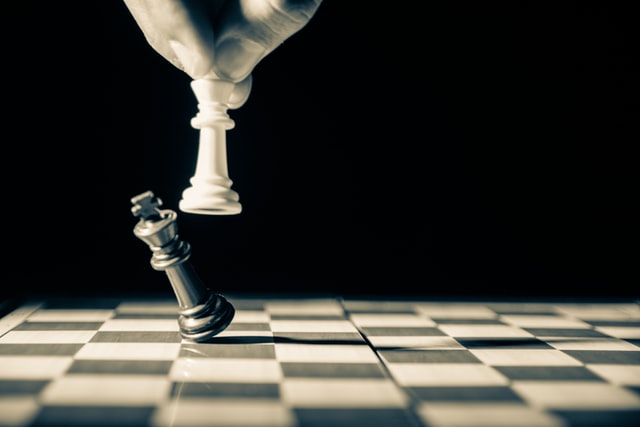 Chess pieces illustrate healthcare competition and the need for a population health center