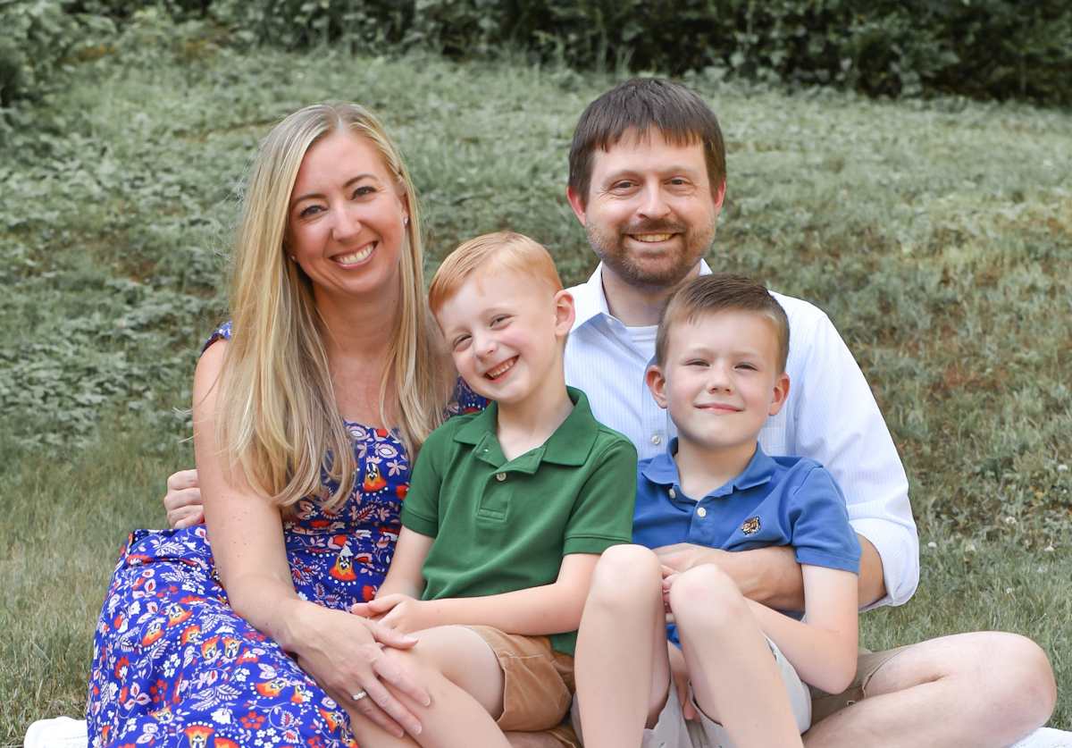 Katie Reilley, Ascendient senior managing consultant, with her husband and two young sons
