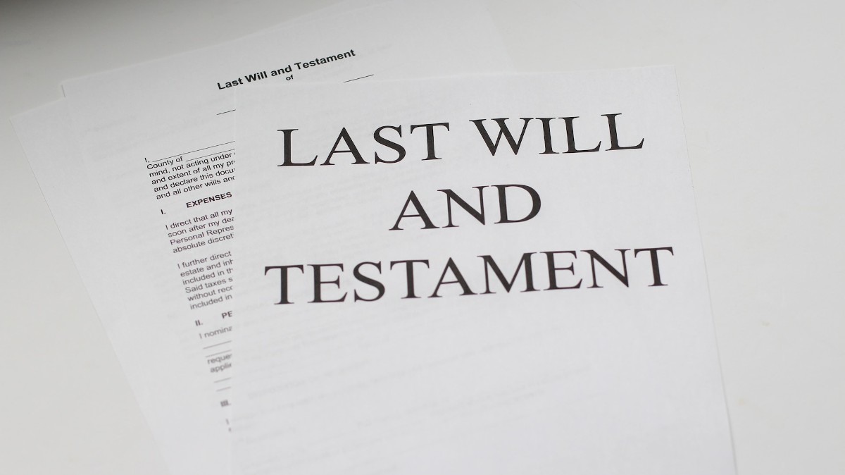 A document reading "last will and testament" illustrates the idea that private equity is a last choice for dying hospitals. Photo by Melinda Gimpel via Unsplash.
