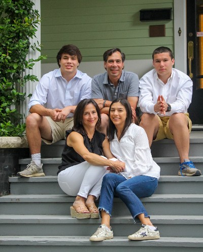 Ascendient senior consultant Kim Meymandi with her family on the front steps of their home